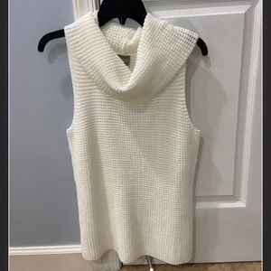 white sleeveless turtleneck